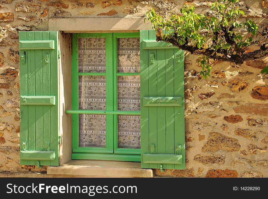 Green shutters and windows of a rural house. Green shutters and windows of a rural house