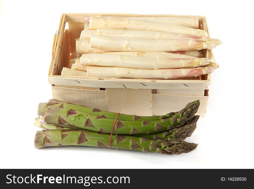 Asparagus in wooden box, fresh vegetable against white background