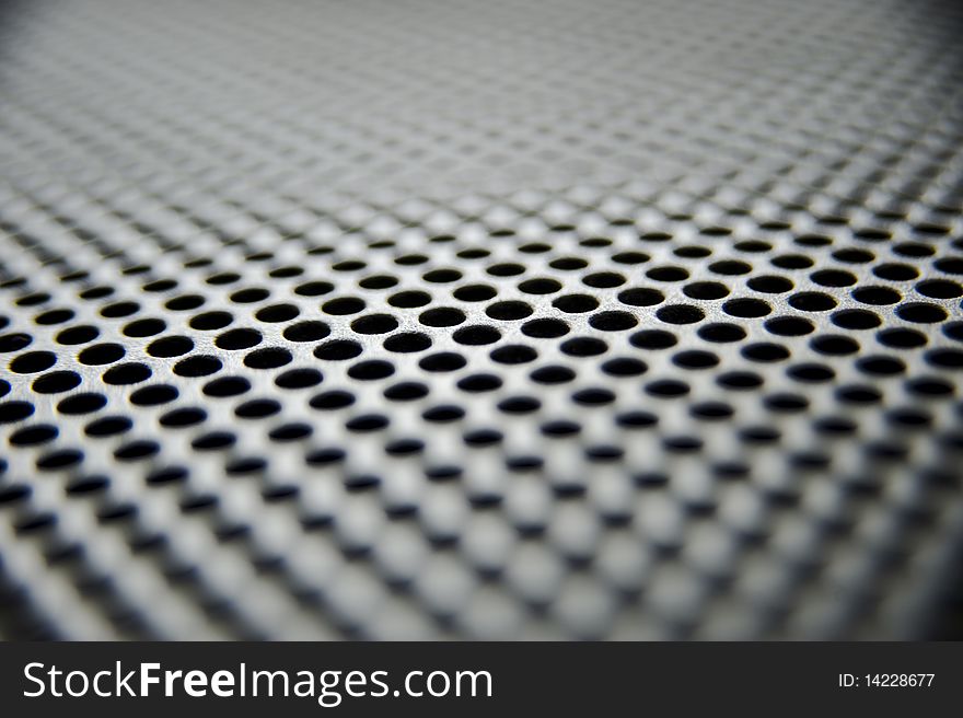 Metal sheet with holes taken as closeup. Metal sheet with holes taken as closeup