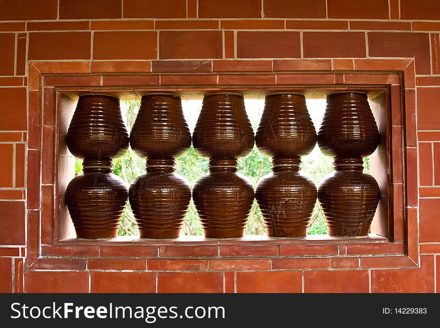 Earthenware pots and red brick wall. Earthenware pots and red brick wall