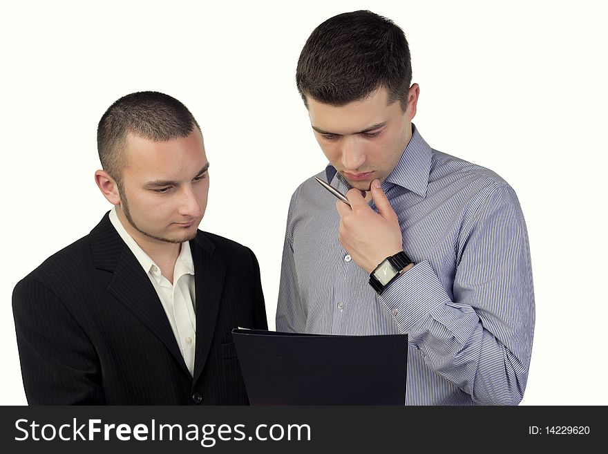 Two business people looking in documents. Two business people looking in documents