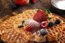 Waffle. Traditional Belgian Waffles With Fresh Fruit And Powder Sugar On Wood Royalty Free Stock Photos