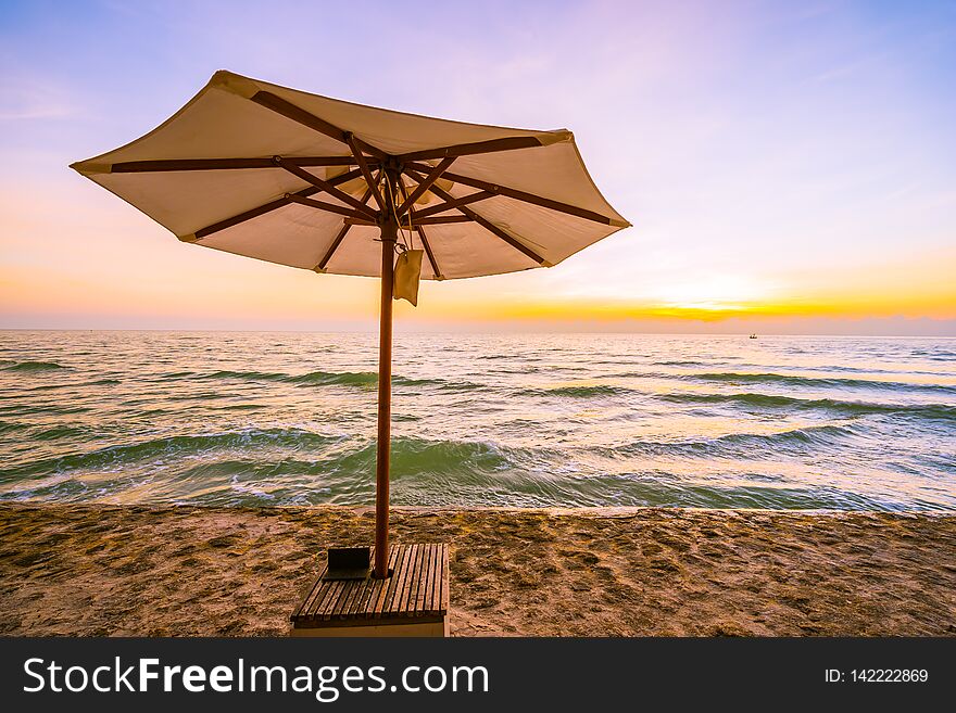 Umbrella And Chair With Pillow Around Beautiful Landscape Of Beach And Sea