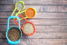 Set Of Different Cereals In Multi-colored Containers, Oatmeal Buckwheat, Barley And Rice Royalty Free Stock Images