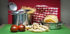 Preparing Pasta , Dry Pasta Of Different Types Tagliatelle, Penne Pot And Ladle Royalty Free Stock Photo
