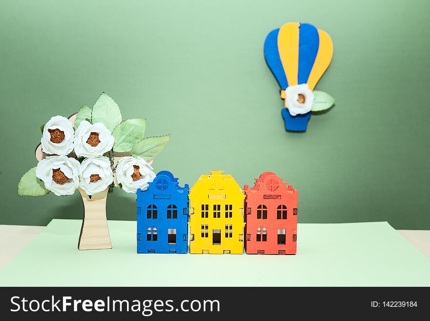 Theme spring , eco-friendly  city, toy houses, a balloon with flowers and a blossoming