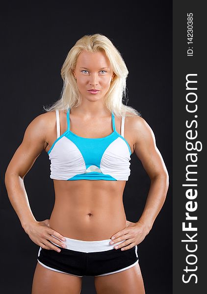 Young attractive woman posing in gym room. Young attractive woman posing in gym room