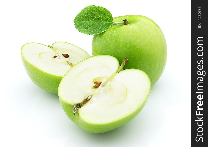 Ripe apples with leaves on a white background