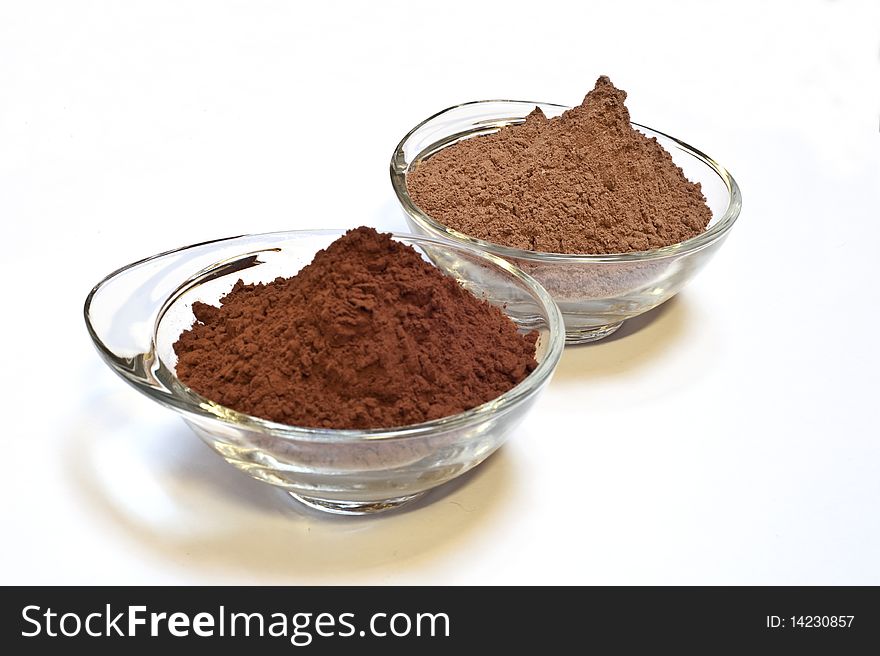 Cocoa cake and cocoa powder on a white background