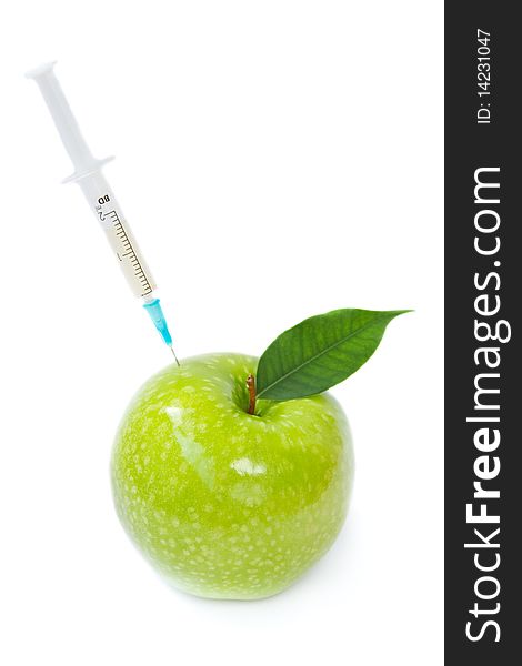Green apple and syringe on a white background