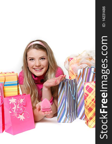 Happy girl with shopping bags over white