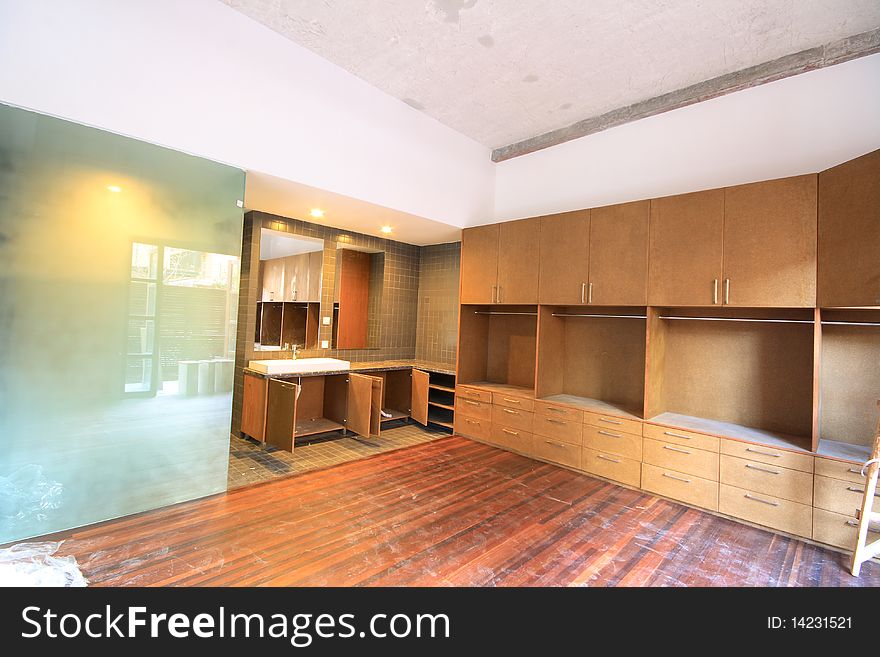 A bedroom with bathroom of an apartment.