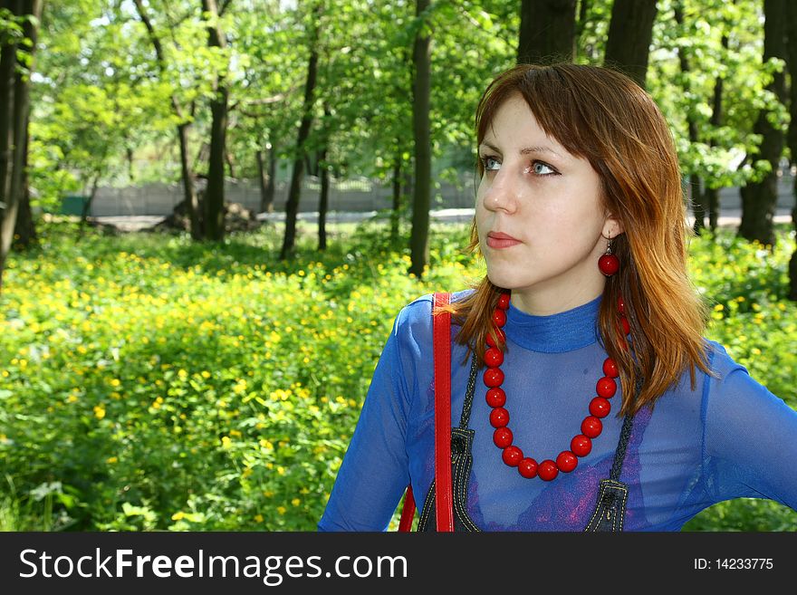 Young woman portrait on the green background