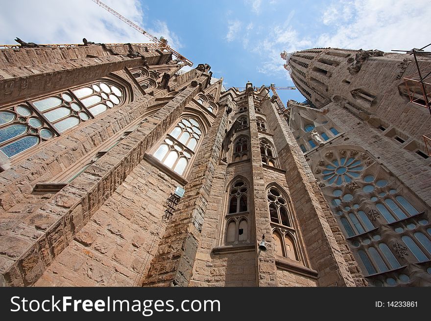 Sagrada Familia's facade, low angle view. Sagrada Familia's facade, low angle view.