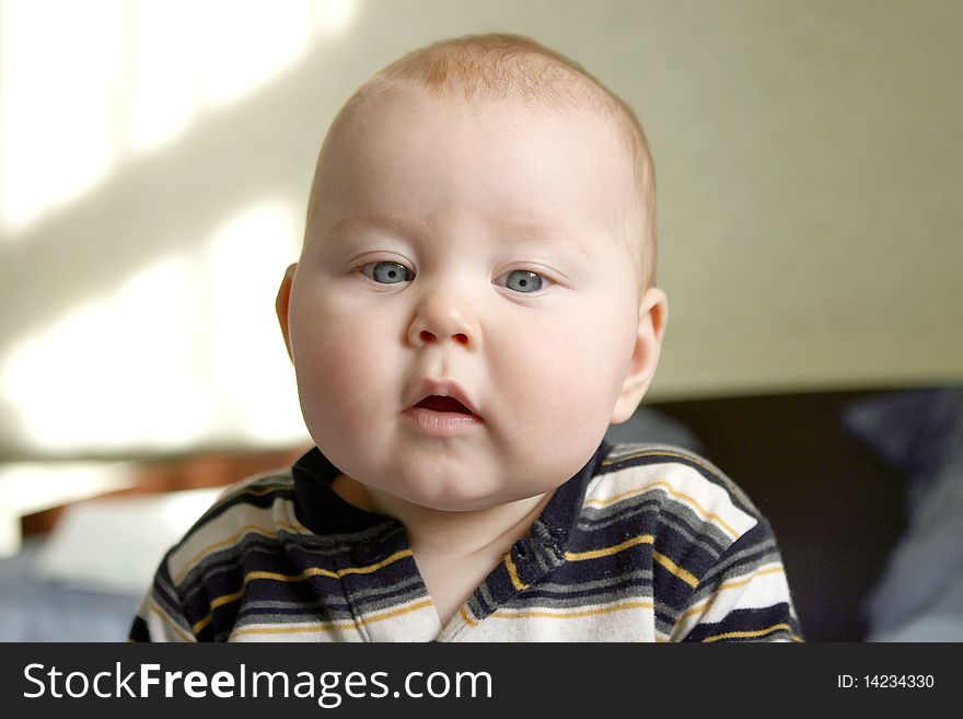 Portrait of little boy, in surprise looking