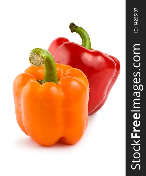 Orange and red pepper isolated on white background