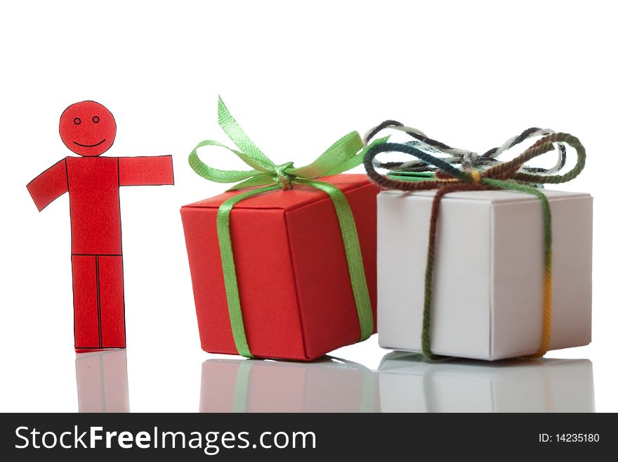 Red toy man and present boxes on white isolated bacground