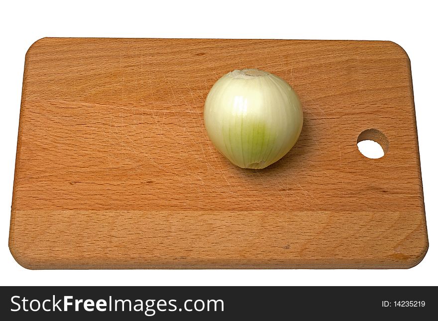 Onion on a breadboard isolated on a white background