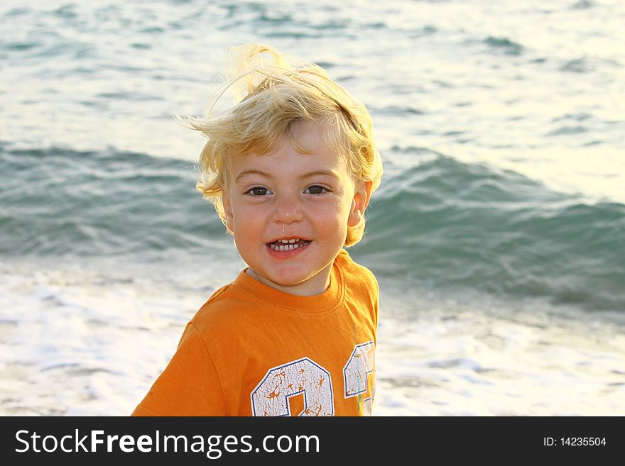 Cute blond boy on a day at the beach. Cute blond boy on a day at the beach.