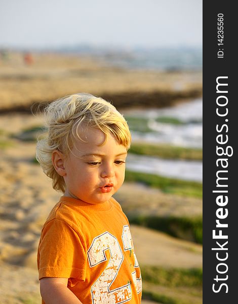 Cute blond boy on a day at the beach. Cute blond boy on a day at the beach.