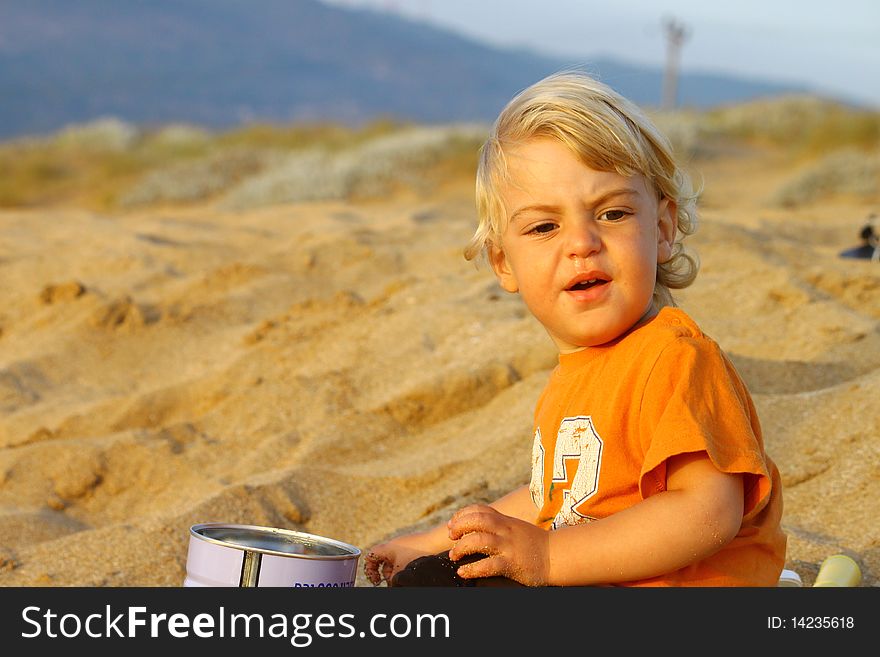 Cute blond boy on a day at the beach. Cute blond boy on a day at the beach.