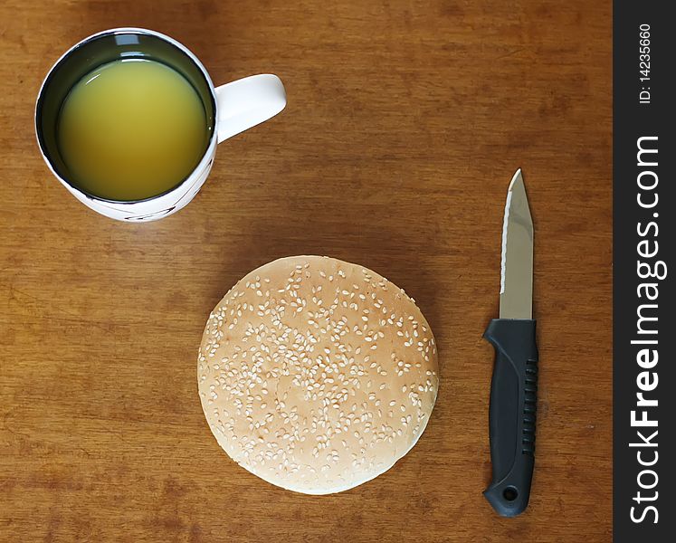 Eat quickly: hamburger with orange juice on the table. Eat quickly: hamburger with orange juice on the table.