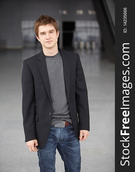 Young handsome caucasian man over cool background