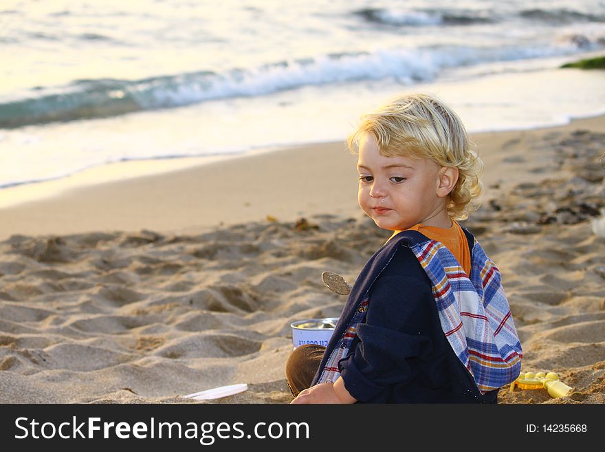 Cute blond boy on a day at the beach. Cute blond boy on a day at the beach.