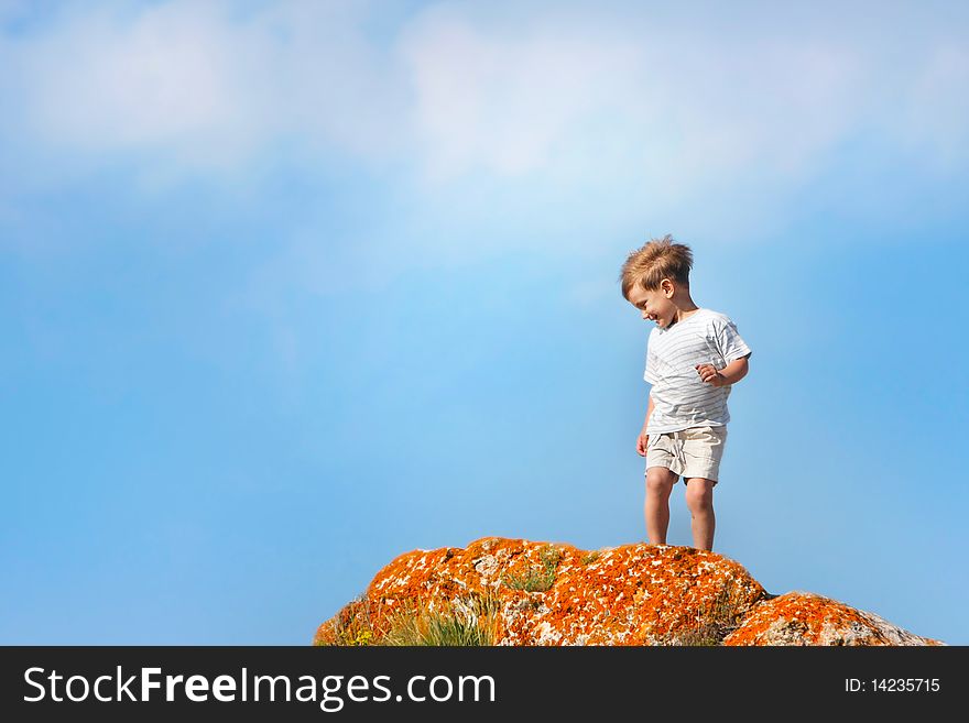 Happy boy outdoors on sky background