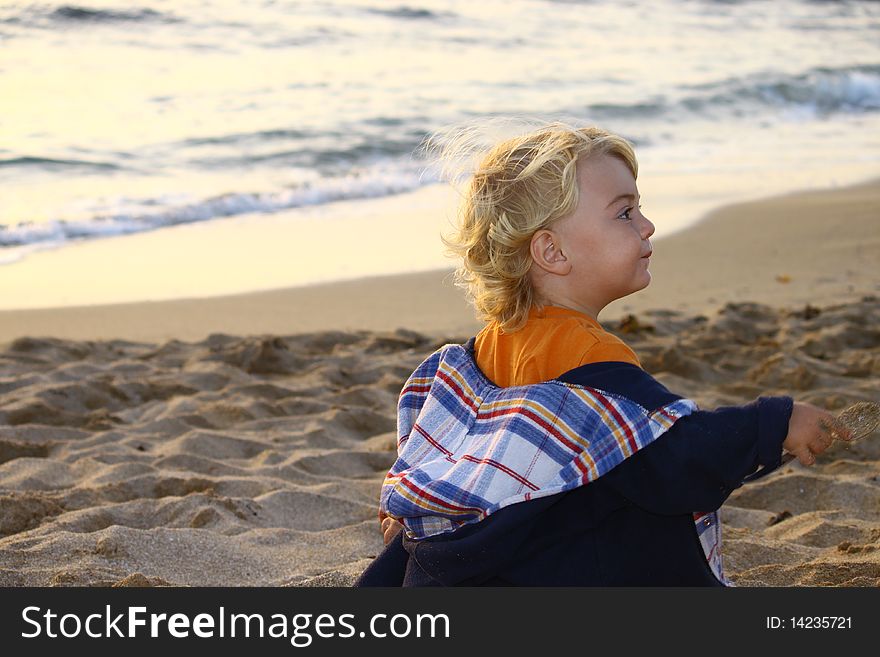 Cute blond boy on a day at the beach. Cute blond boy on a day at the beach.