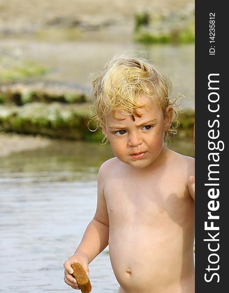 Cute blond boy on a day at the beach. Cute blond boy on a day at the beach.