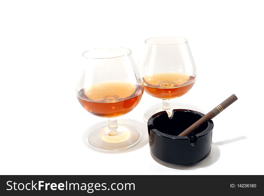 Glasses of cognac ranked isolated on a white background. Glasses of cognac ranked isolated on a white background