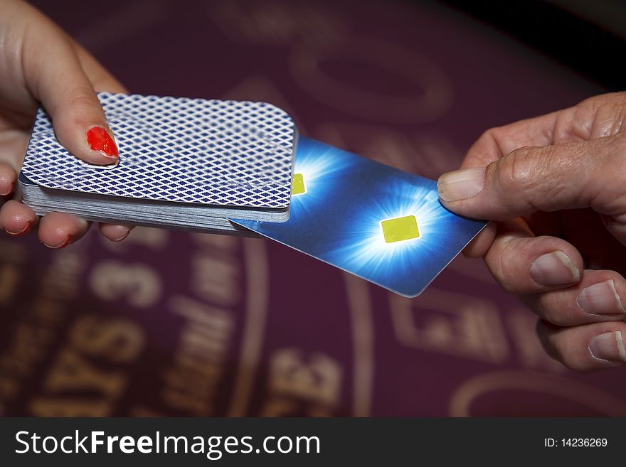 Player cutting a deck of cards at a blackjack table. Player cutting a deck of cards at a blackjack table