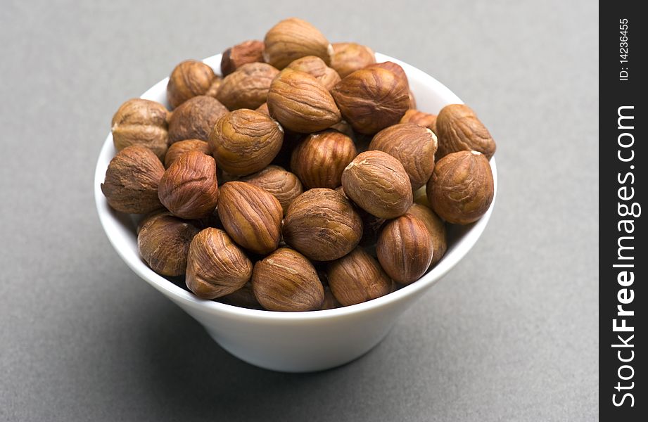 Hazelnuts In A White Dish