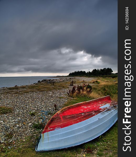 An Old Abandoned Boat Near The Shore In Denmark