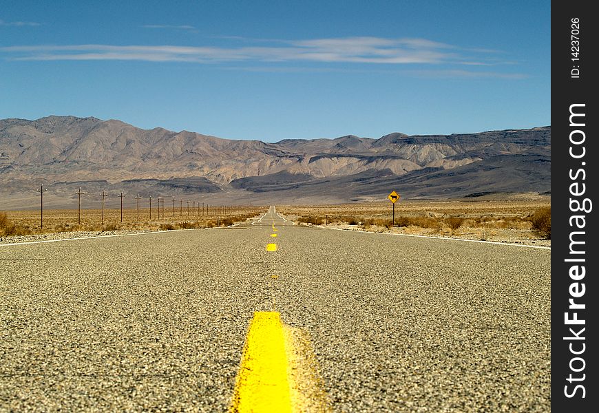 Desert road through Death Valley, California