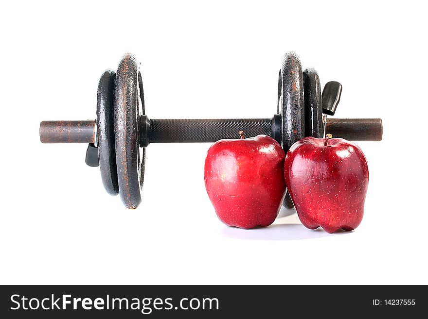 Healthy way of life, dumbbells for sports and red apples. Healthy way of life, dumbbells for sports and red apples.