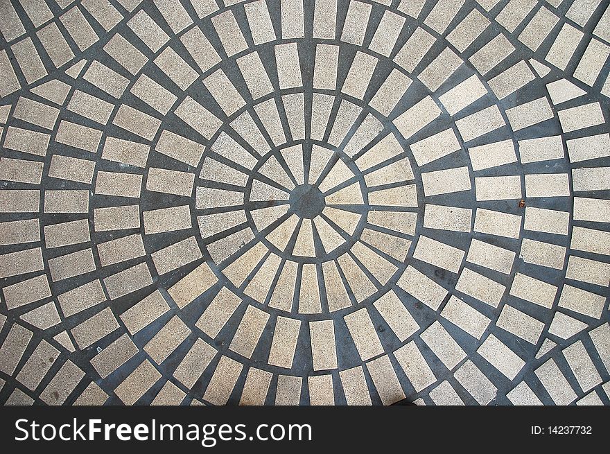 An abstract view of a round outdoor tiled floor.  . An abstract view of a round outdoor tiled floor.
