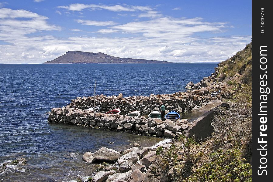 Small boat harbor by a Peruvian lake