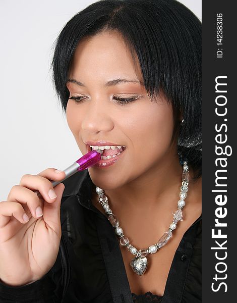 Beautiful young business woman biting a pen