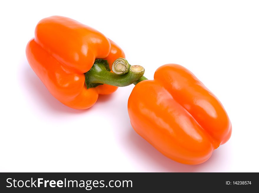 Two orange sweet peppers