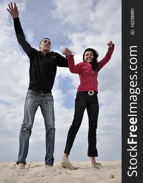 An image showing young girl and boy on the beach. An image showing young girl and boy on the beach