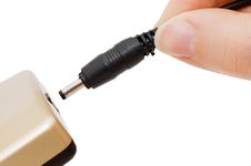 Hand Inserts A Cord Into The Device Stock Photography Hand Inserts A Cord Into The Device Stock Photography