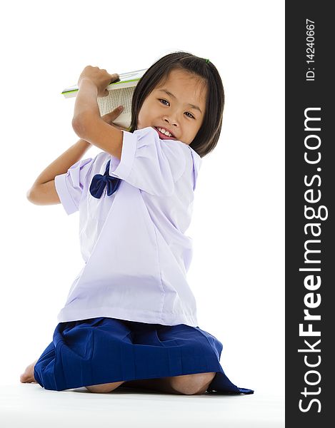 Cute girl throwing a book, isolated on white background