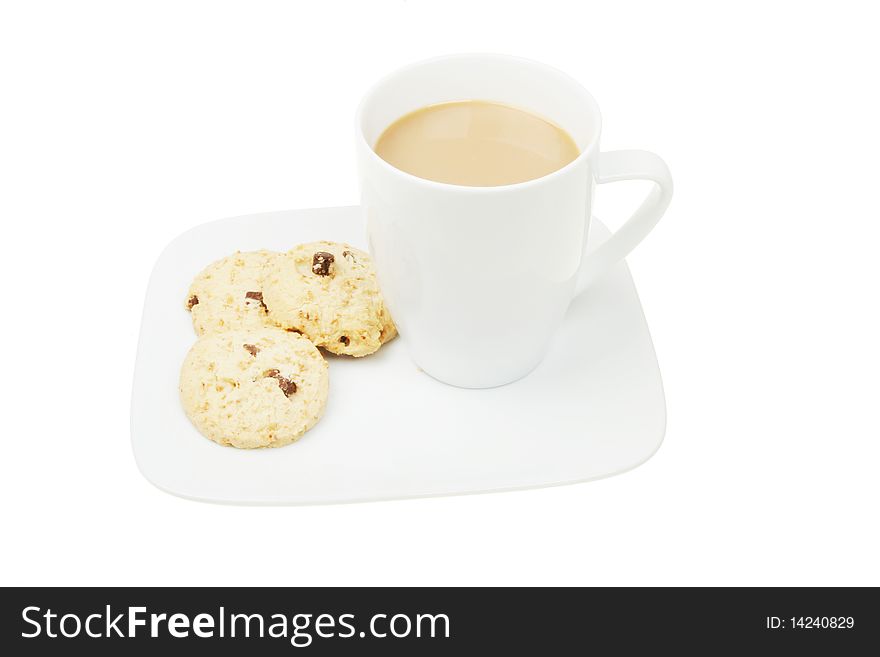 Mug of coffee and cookies on a plate