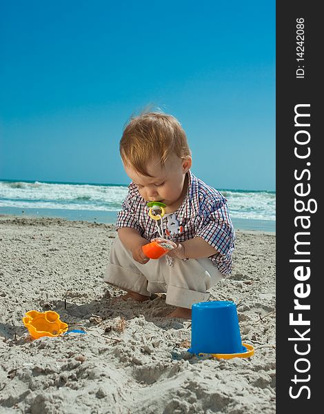 Child playing on a beach. Child playing on a beach