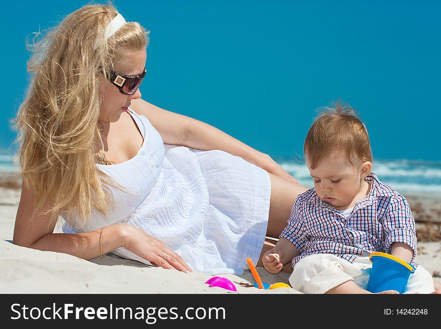 Child and mother on a beach. Child and mother on a beach