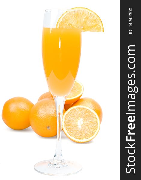 Glass of fresh orange juice and fruit on a white background