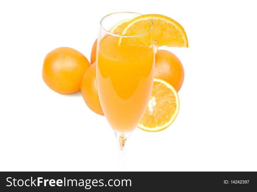 Glass of fresh orange juice and fruit on a white background