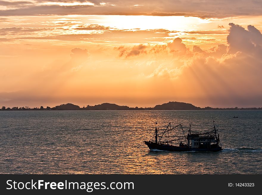 Sunrise on the east sea of Thailand which a boat is sailing pass. Sunrise on the east sea of Thailand which a boat is sailing pass